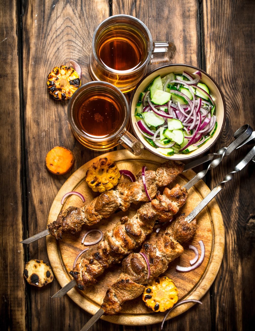 Pork kebab with beer and vegetables.